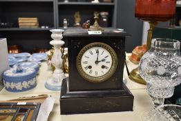 A Victorian black slate mantel clock, having a knopped gilt metal finial top over an enamelled