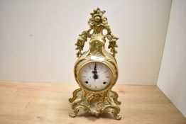 A late 19th to early 20th-century Rococo-style ?Ting Tang? gilt brass mantel clock, having Roman