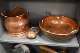 Three late 19th-century to early 20th-century copperwares, to include a large copper bowl having
