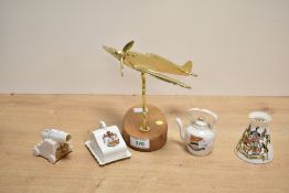 A contemporary brass spitfire upon a wooden stand, having a plaque inscribed with a Winston