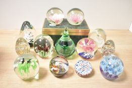 A large fine selection of mid to late 20th-century studio art glass paperweights, to include a