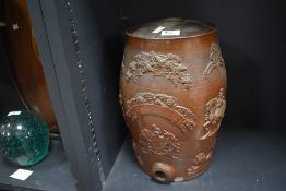 A Victorian salt-glazed stoneware spirit barrel, of traditional form, moulded in relief with the