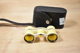 A pair of Soviet USSR Russian Opera/Theatre binoculars, of a bright yellow colour, with original