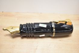 A large late 20th-century Silver Crane Company novelty ceramic Parker Fountain pen-shaped desk tidy,