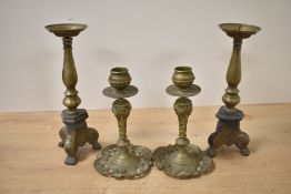 Two sets of 19th-century brass candlesticks, to feature a smaller pair of Louis XV-style examples,