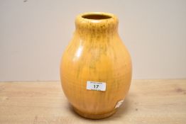 An early 20th-century Pilkington's Royal Lancastrian pottery vase, featuring a soft yellow and