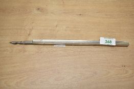 A presumed late 19th-century to early 20th-century white metal extendable dip pen, having an
