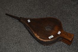 A pair of Victorian wood and leather fireplace bellows, having a metal nozzle, unmarked, 63cm,