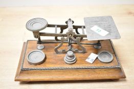A fine 19th-century W. Leuchars of Piccadilly metal and wood postal letter scales, featuring a set