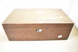 An early 20th-century mahogany writing slope, having interior compartments, soft green slope and a