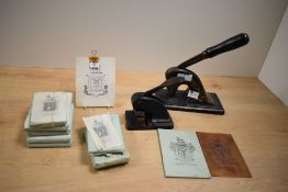 Two 19th-century cast iron desktop seal embossers, one featuring gilded floral and foliate