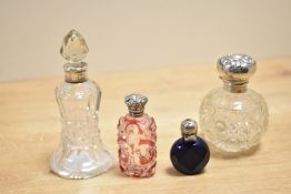 A quantity of late 19th to early 20th-century Silver and glass perfume bottles, to include a small