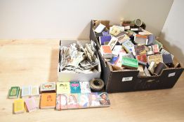 A large quantity of 20th-century miniature matchboxes and skillets, featuring sports, novelty,