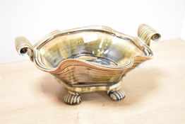 A 20th-century John Calver Studio pottery stoneware bowl, of a wavy organic shape with scrolled