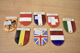 A selection of 20th-century enamelled brass car bumper shield badges, to include examples