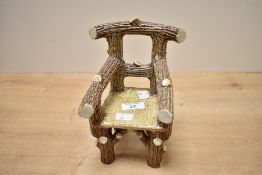 Thought to be late early 20th-century Scottish miniature faux bois pottery chair, featuring