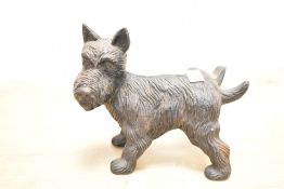 A late 20th-century Band Wagon Inc cast iron Scottish Terrier doorstop, often referred to as a '