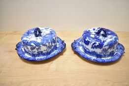 Two early 20th-century Royal Doulton 'Oyama' cheese domes, featuring a traditional blue and white