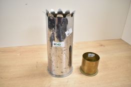 An early 20th-century British Trench Art spent 18-pounder field-gun shell, the rim decorated and