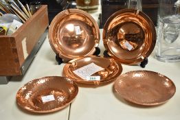 Five late 20th-century Rhodesia Copper Products trays, to feature two hammered copper dishes and