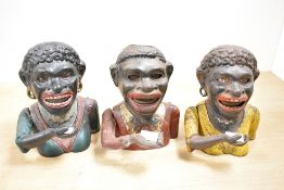 Three late 19th to early 20th-century painted cast iron 'Jolly' mechanical money bank, to feature