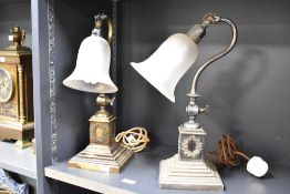 Two Edwardian brass and metal adjustable table desk lamps, featuring frosted glass bell-shaped