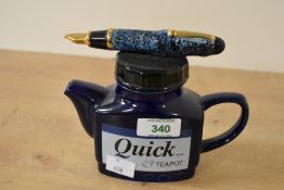 A vintage Swineside Teapottery ceramic Quick Ink Teapot, featuring a hand decorated body shaped like