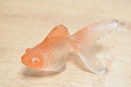 Thought to be mid 20th-century moulded glass goldfish figurine, with soft orange accents,