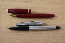 Two Parker fountain pens. A Parker Duofold aerometric fill in Burgundy with Parker 14K England 25