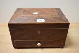A fine 19th-century mahogany jewellery box of soft sarcophagus-form, featuring fine boxwood inlay