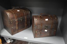 Two late 20th-century decorative wooden chests, both featuring arched lids, metal fittings, faux-