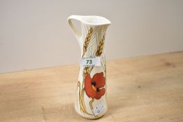A small 20th-century Moorcroft Pottery 'Harvest Poppy' jug, designed by Emma Bossons, featuring