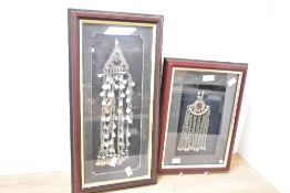 Thought to be two 20th-century framed Yemeni alloy pendants