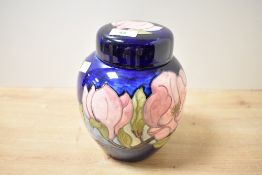 A 20th-century Moorcroft Pottery 'Magnolia' ginger jar, featuring tube-lined pink floral decoration,