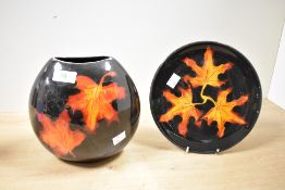Two 20th-century Poole Pottery 'Forest Flame' wares, to include a vase and small plate, featuring