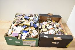 A large quantity of 20th-century miniature matchboxes and skillets, featuring sports, novelty,