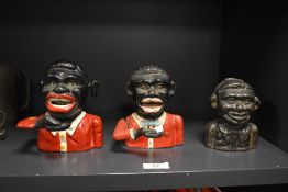 Three 20th-century reproduction ?Jolly Boy? cast iron mechanical coin banks, two examples with