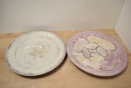 Two decorative 20th-century Kenyan carved soapstone chargers, featuring incised swimming fish