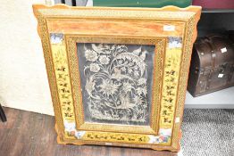 A large decorative 20th-century framed Persian-style Ghalamzani engraving, featuring a scene of
