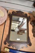 Thought to be 19th-century Georgian-style mahogany wall mirror, featuring scrolled fretwork to the