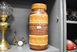 A tall mid-20th-century West German ceramic floor vase, featuring a moulded pattern of flowers,