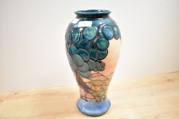 A tall 20th-century Moorcroft Pottery 'Mamoura' vase designed by Sally Tuffin (b.1938), of