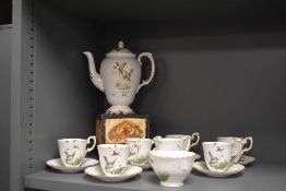 An early 20th-century Crown Staffordshire fine bone china 'game bird' tea set, featuring hand