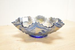 A 20th-century Fenton carnival glass bowl in Amethyst/purple having a ruffled rim, featuring