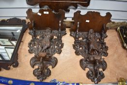 A fine pair of 18th-century/19th century Flemish-style carved wooden wall brackets, featuring