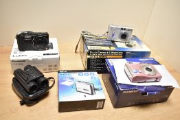 Three digital cameras, a Cassette Converter and a pair of Binoculars. A boxed Olympus X42 camera,
