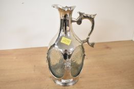 A late 20th-century Indian I.M.F.L metal caged glass spirit decanter, having faux metal hinges and a