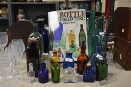 A fine collection of late 19th to 20th-century glass bottles, to feature an array of shapes, sizes