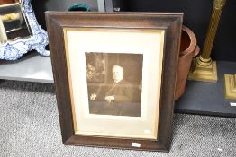 Two late 19th-century framed portrait photographs, to feature an 'At Home Portrait' of a gentleman