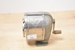 A vintage American Hunt Manufacturing Company 'Boston KS' metal desk-mounted manual pencil